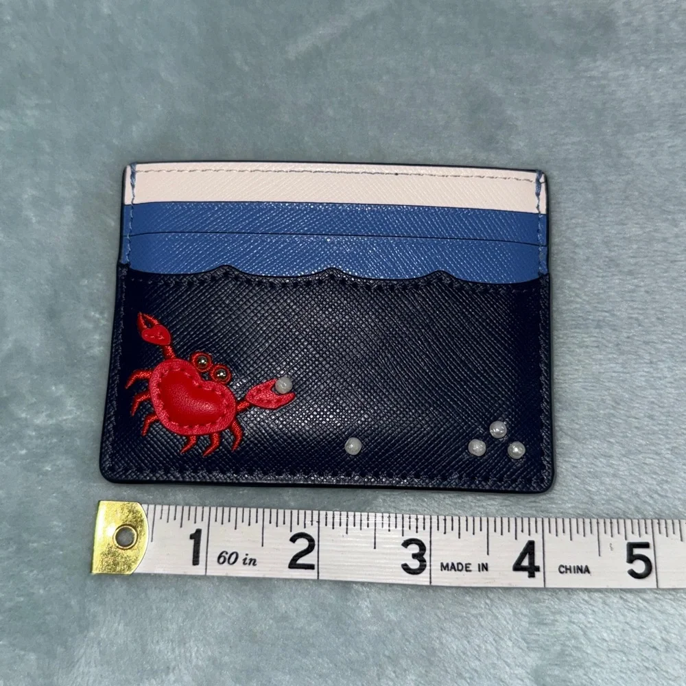 kate spade New York Pinch Me Crab Pearl Beach Blue small slim card holder.